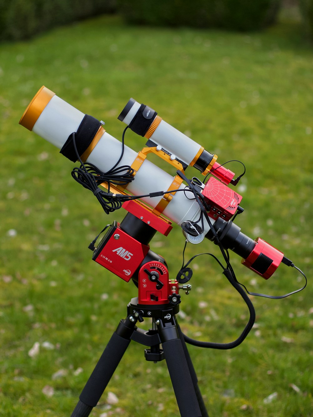 Astrophotography telescope with attached astronomy camera, guide scope, and tracking mount
